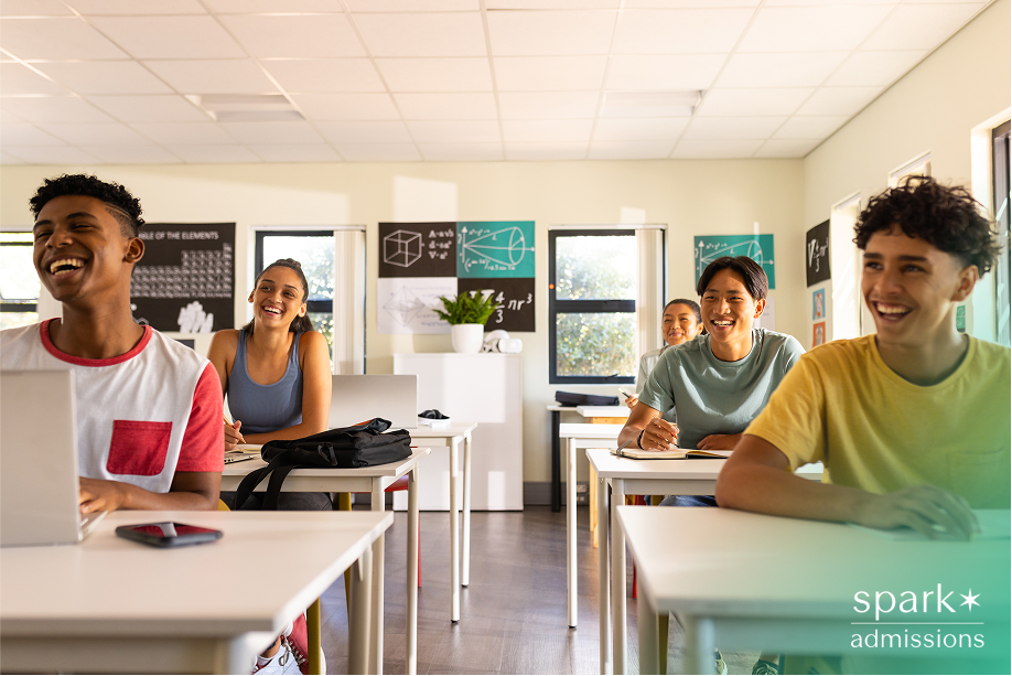 Group of high school students smiling and engaged in class