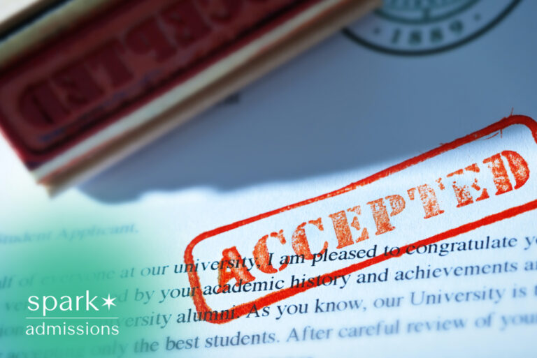 College acceptance letter with approved admission stamp, symbolizing successful university acceptance.