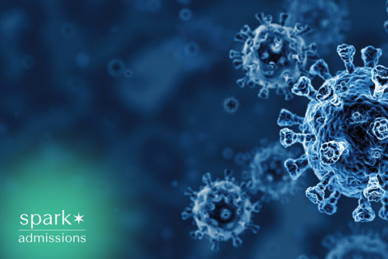 3D microscopic illustration of coronavirus (COVID-19) virus particles on a blue background.
