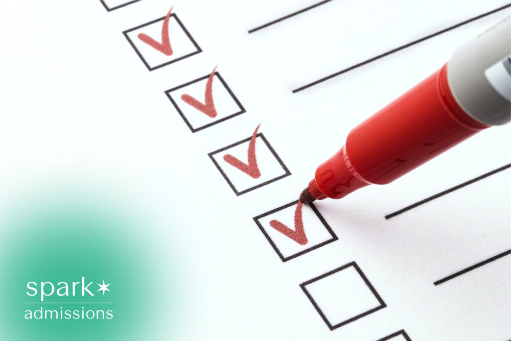 Red marker checking boxes on a completed student success checklist or academic planning form.