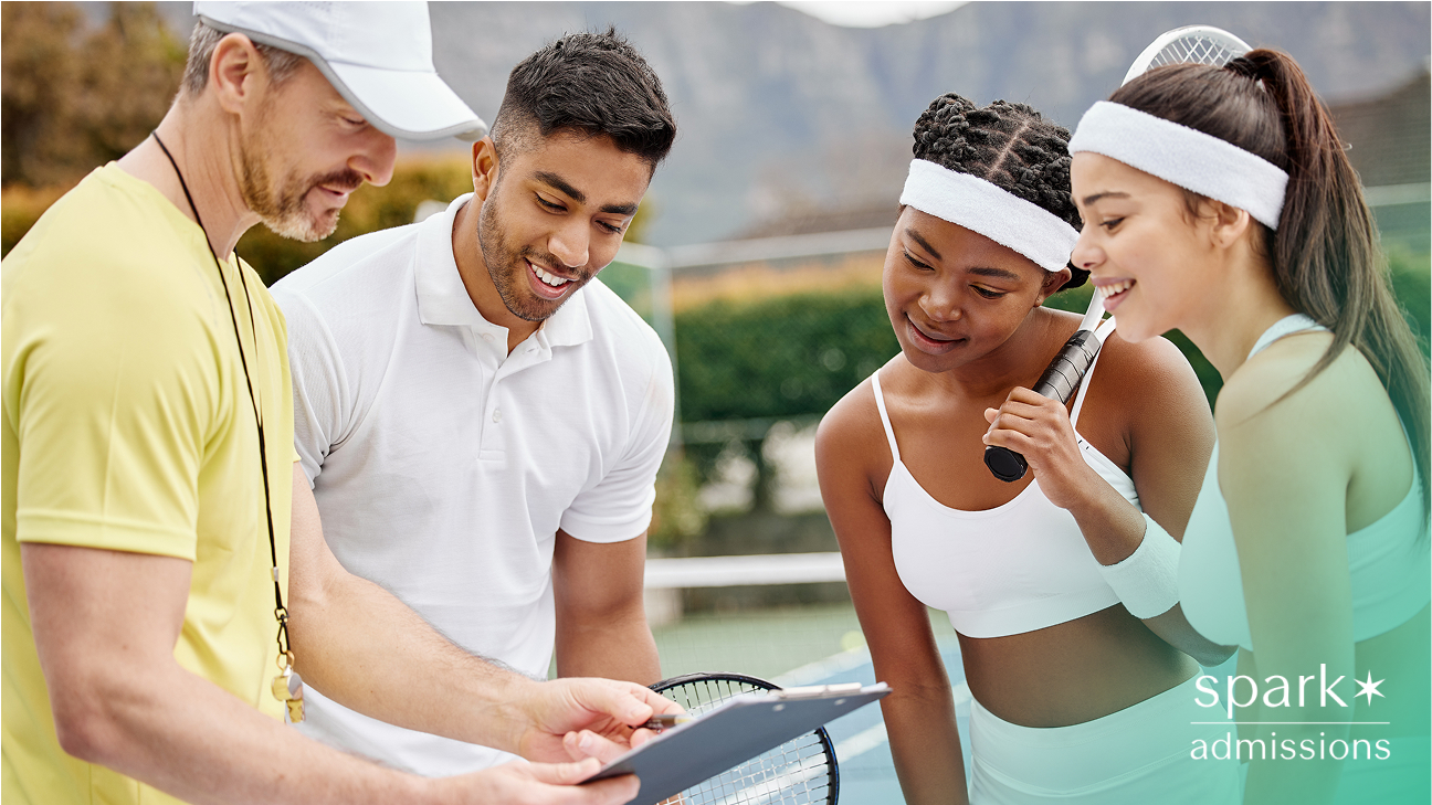 Tennis coach reviewing notes with three student-athletes on a court