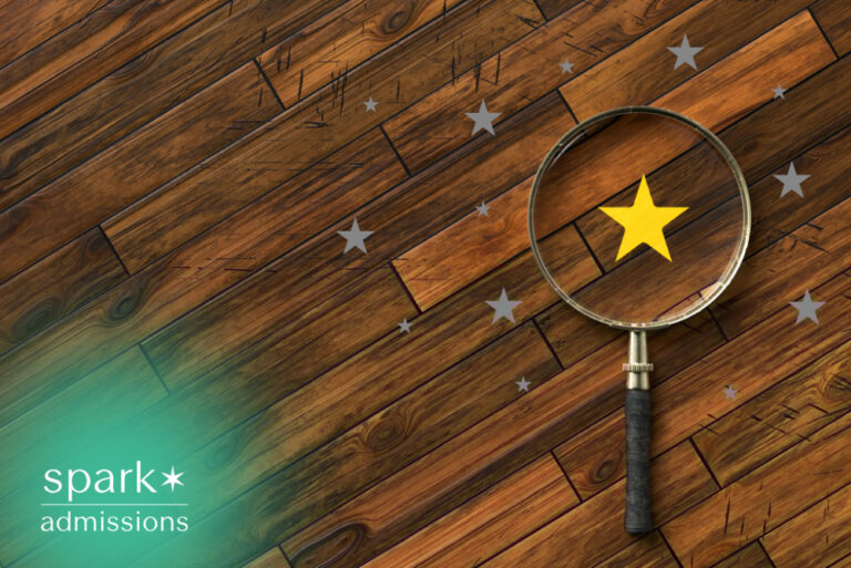 Magnifying glass highlighting a gold star to represent discovering unique strengths