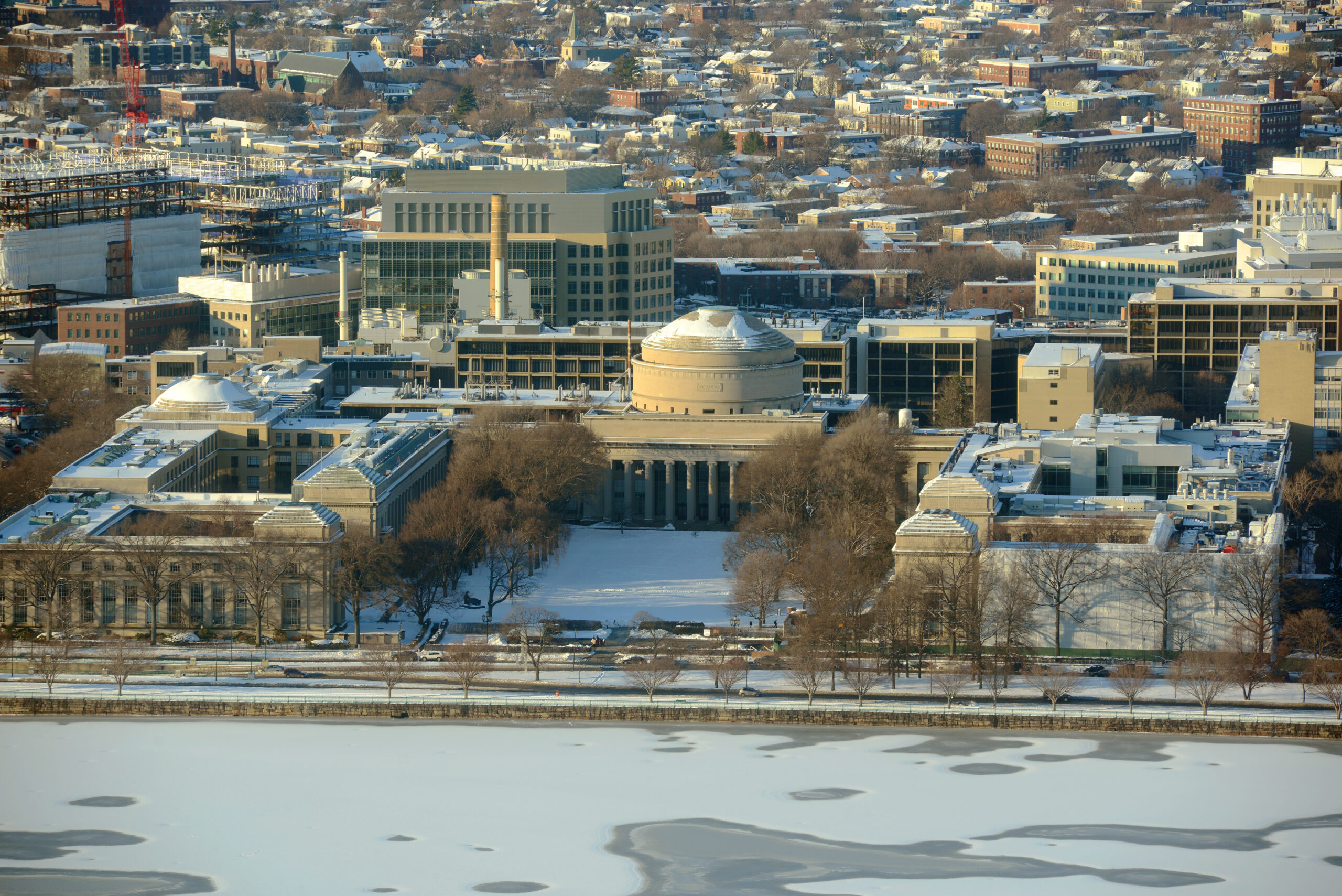 Aerial view of the MIT campus with snow-covered buildings and trees in Cambridge, Massachusetts