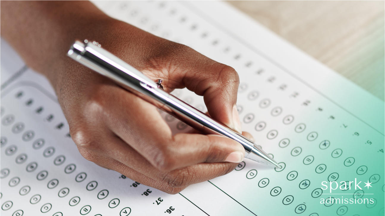 Close-up of a student filling in a standardized test answer sheet with a pen