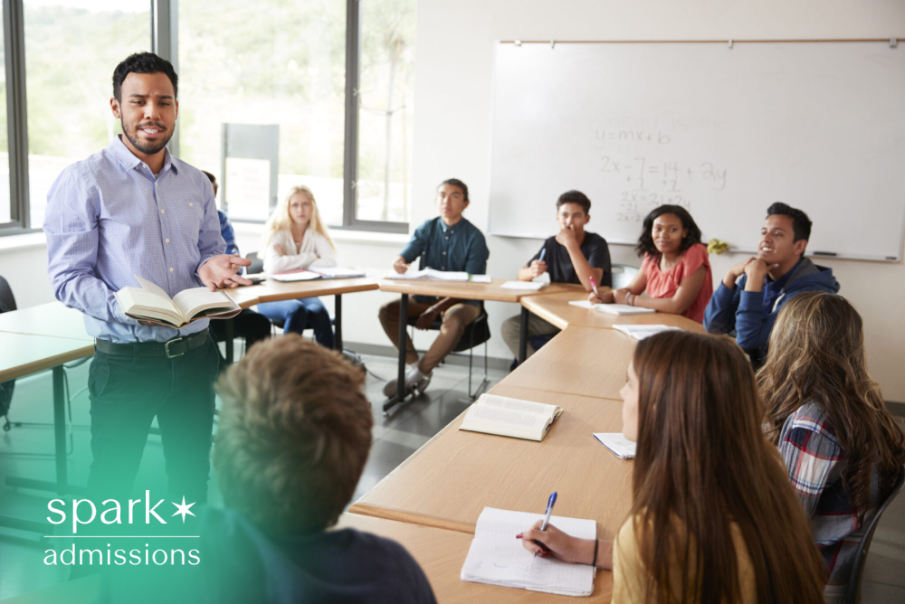 College professor leading a classroom discussion with university students engaged in an interactive lesson.