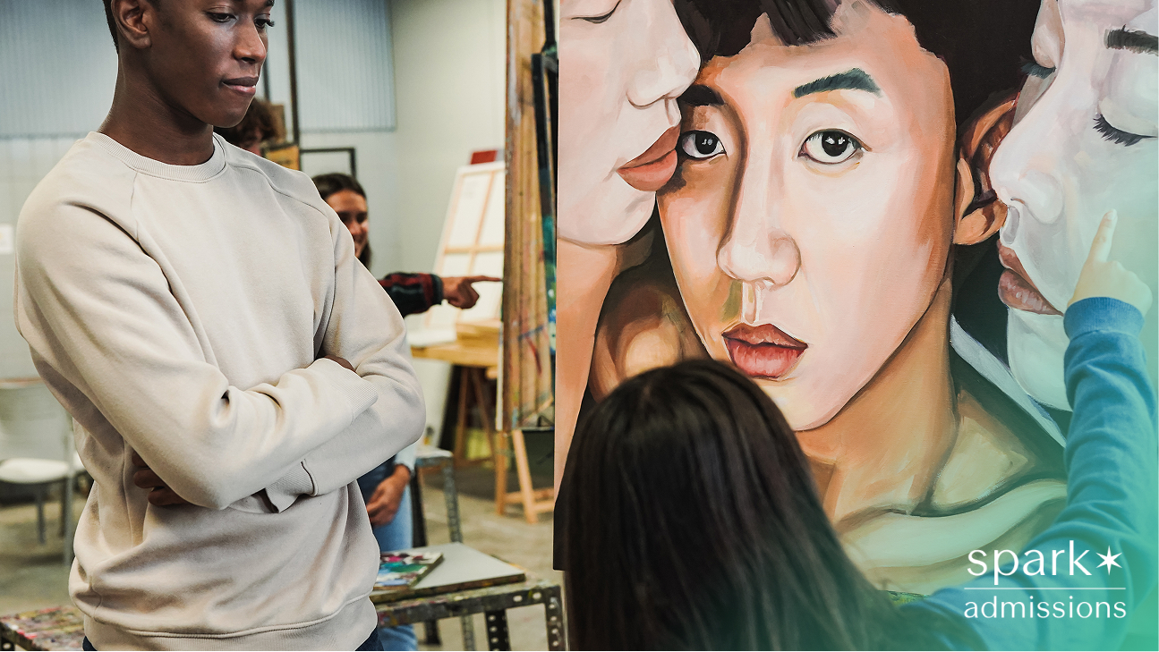 Student viewing and discussing a large, expressive portrait painting in an art studio