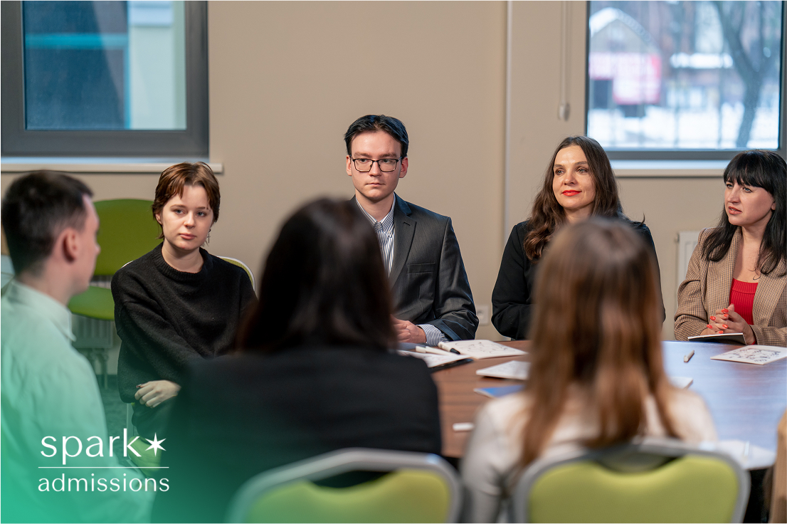 Students gathered at a panel discussion, engaged in conversation and learning