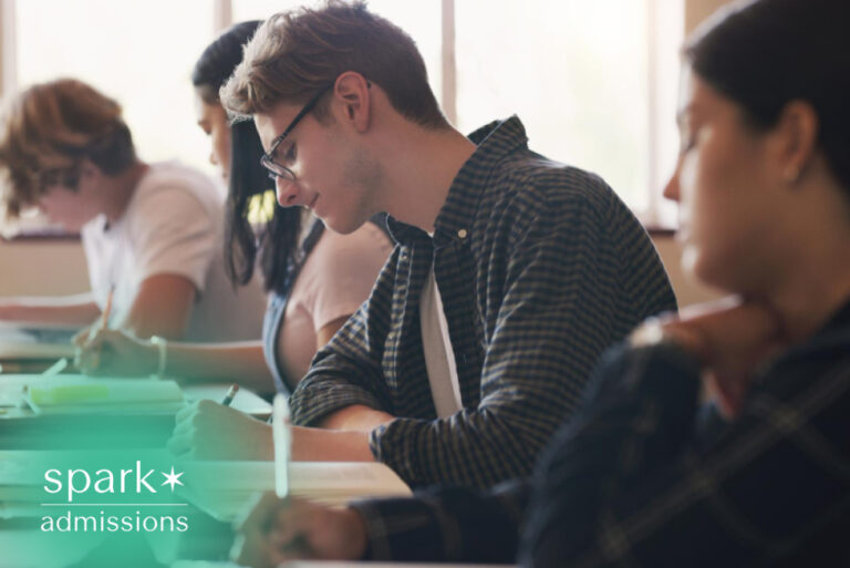 Students taking notes during a classroom lecture