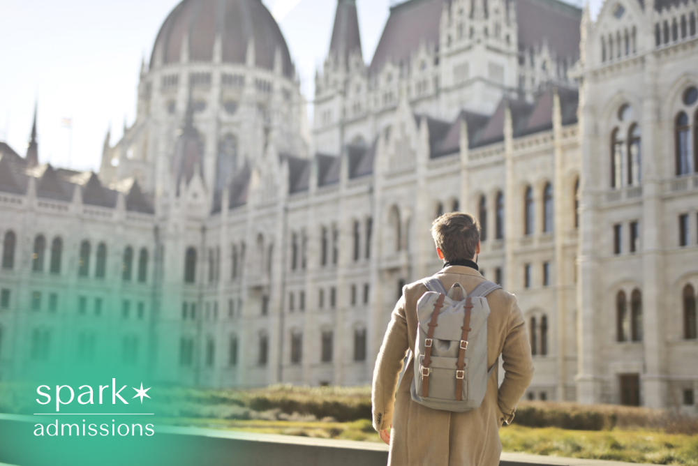 Student with backpack visiting a historic university building