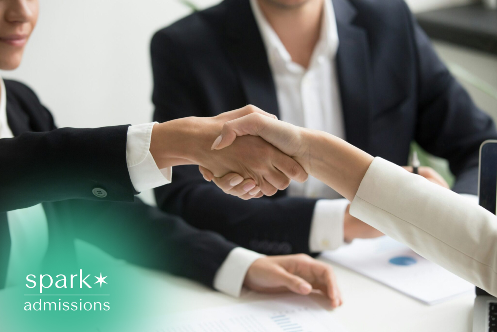 Business professionals shaking hands during a meeting