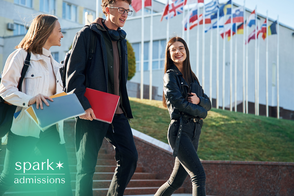 International students walking on campus with notebooks