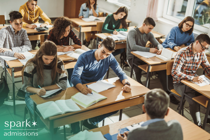 High school seniors taking final exams in classroom