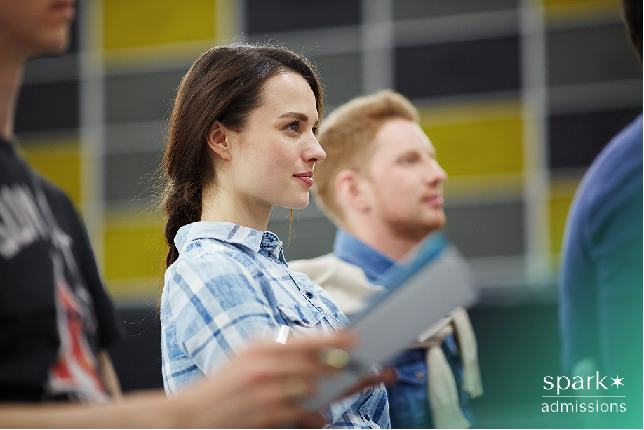 Students participating in a music rehearsal, representing how arts activities contribute to competitive college applications.