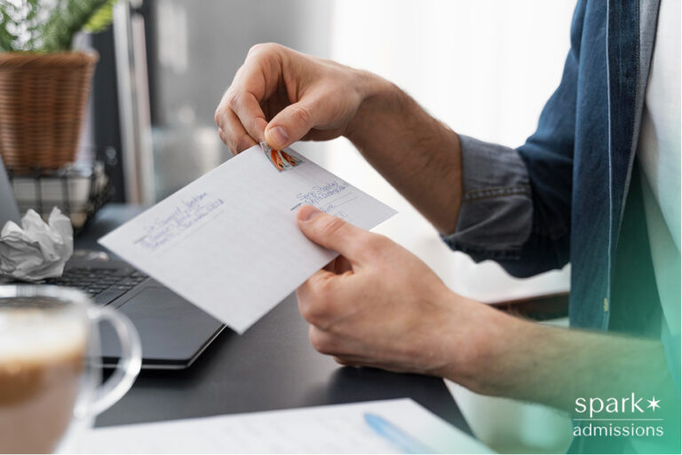 Close up man sealing envelope