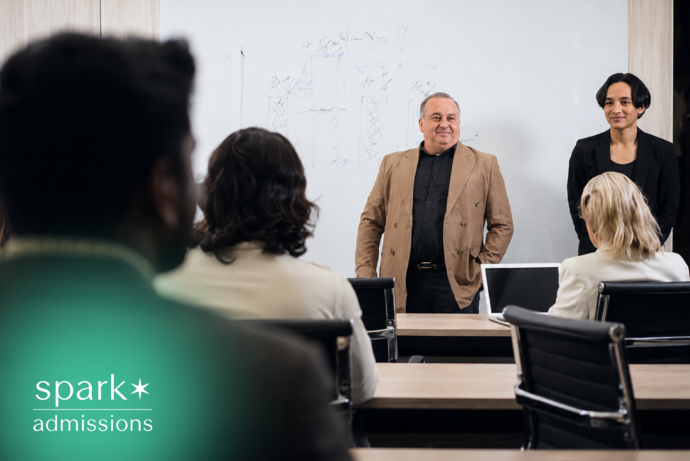 Professionals attending a classroom training presentation