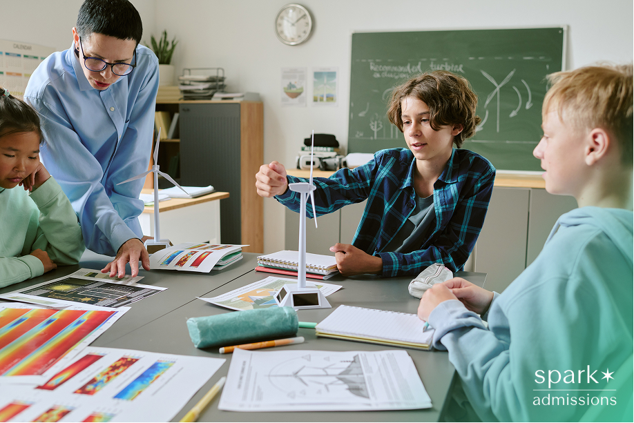 High schoolers working on a hands-on STEM project, illustrating productive learning activities.