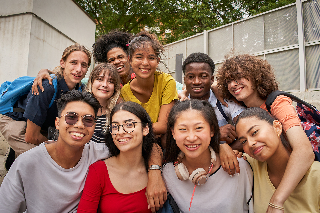 Selfie of a group of students looking at the camera smiling.