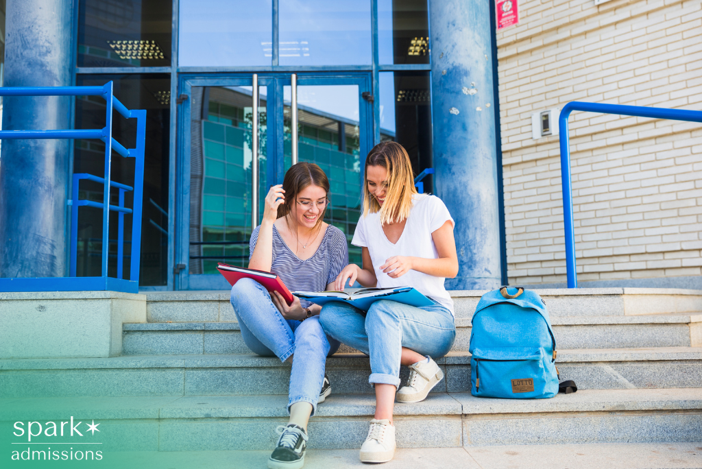 High school student and mentor reviewing private school admissions documents