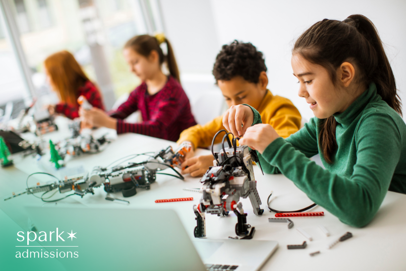 Young students assembling robotics projects in a school robotics club
